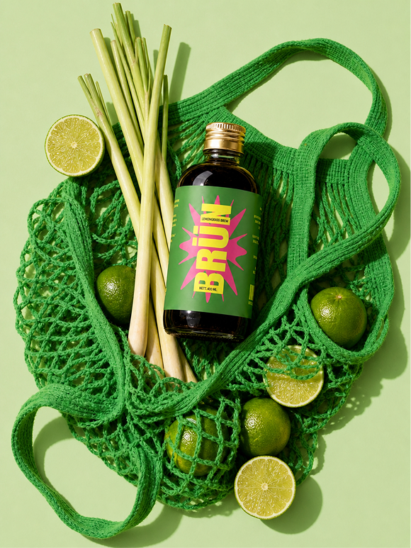 Lemongrass bottle in a net bag with limes